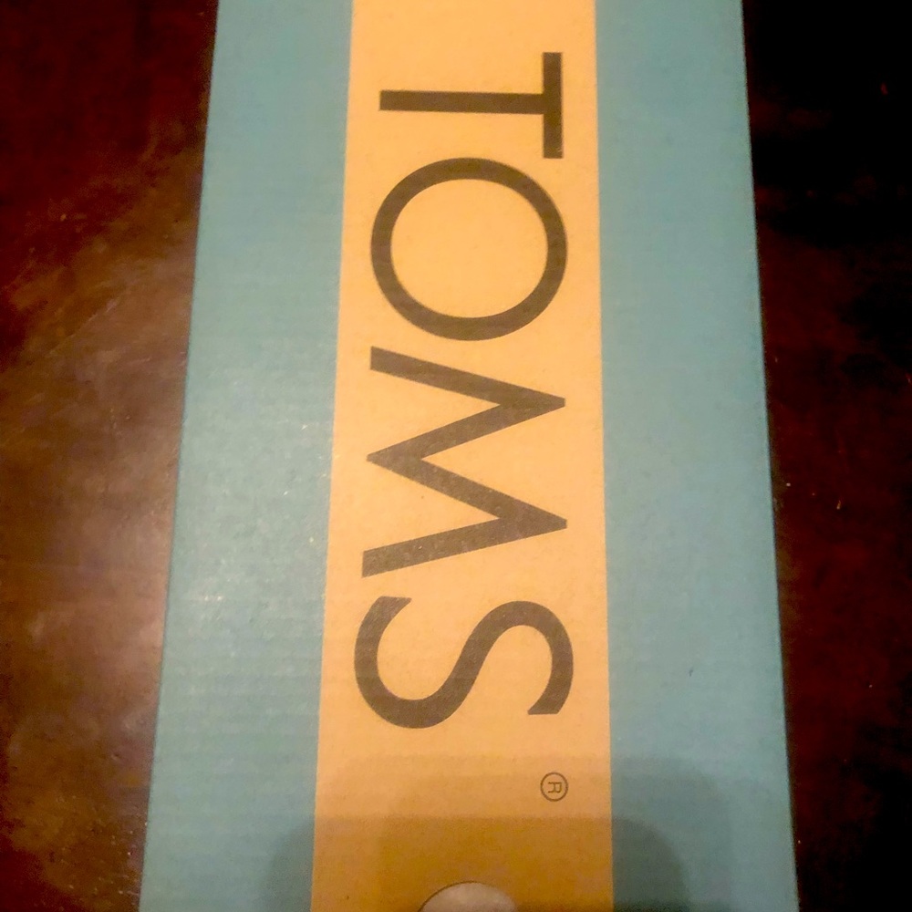 Silver iridescent glimmer Toms shoes for youth girls.